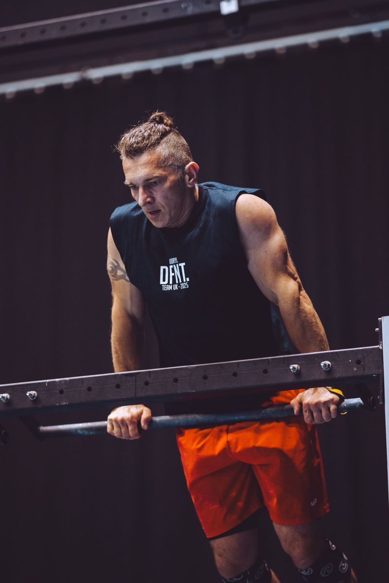 Adam, head coach, training on the dip bars