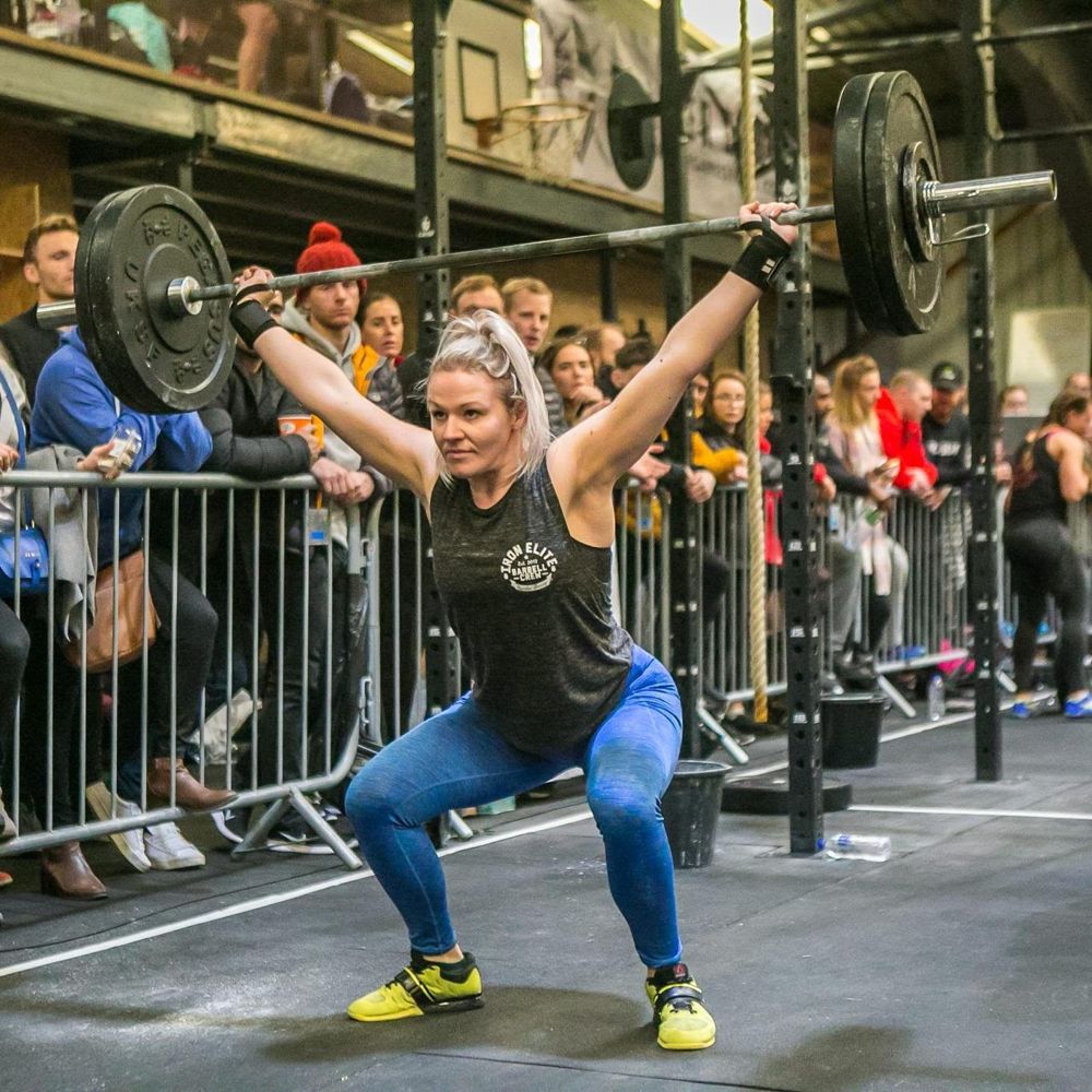 Charlie holding an overhead squat at a competition