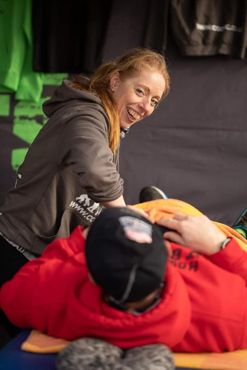 Vic smiling while giving a sports massage